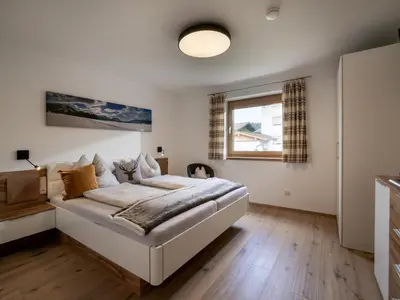 Ein Bett oder Betten in einem Zimmer der Unterkunft Bergpanorama Kössen
