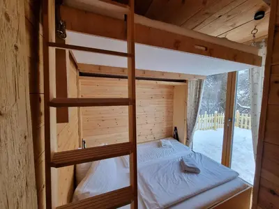 Ein Bett oder Betten in einem Zimmer der Unterkunft Chaleny - Das erste Tiny House Chalet im Zillertal