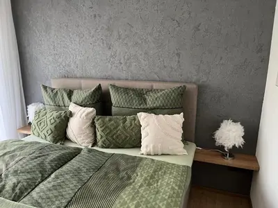 Ein Bett oder Betten in einem Zimmer der Unterkunft Ferienwohnung Dahoam