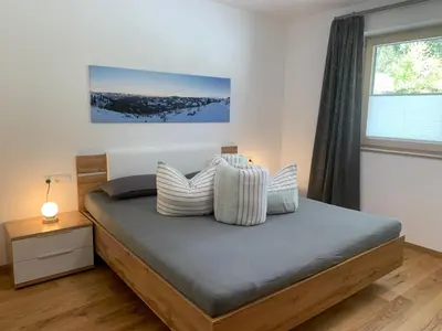 Ein Bett oder Betten in einem Zimmer der Unterkunft Appartement Dorfblick