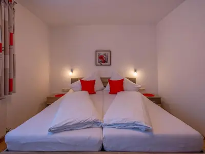 Ein Bett oder Betten in einem Zimmer der Unterkunft Ferienwohnung Krimbacher