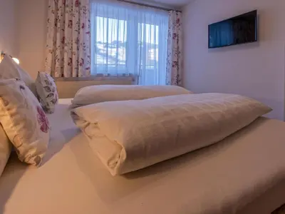 Ein Bett oder Betten in einem Zimmer der Unterkunft Ferienwohnung Krimbacher