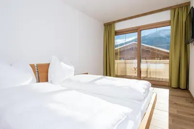 Ein Bett oder Betten in einem Zimmer der Unterkunft Haus Mühlleiten