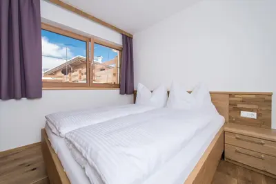 Ein Bett oder Betten in einem Zimmer der Unterkunft Haus Mühlleiten