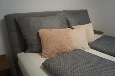 Ein Bett oder Betten in einem Zimmer der Unterkunft Ferienwohnung Julia Pillerseetal