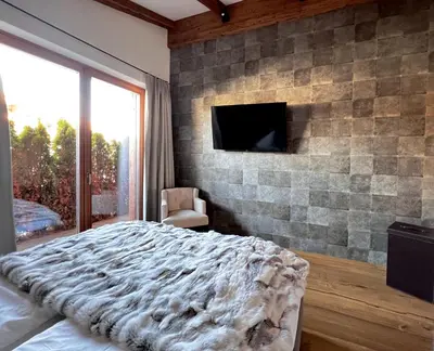 TV/Unterhaltungsangebot in der Unterkunft HIDEAWAY DESIGN CHALET by Belle Stay