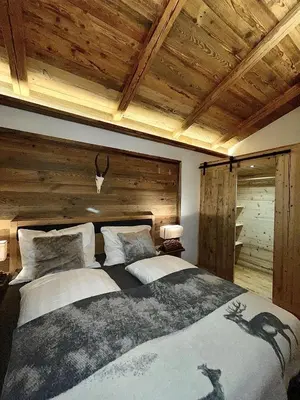 Ein Bett oder Betten in einem Zimmer der Unterkunft das brunn - Luxus Chalet