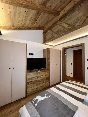 Ein Bett oder Betten in einem Zimmer der Unterkunft das brunn - Luxus Chalet