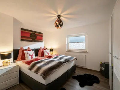 Ein Bett oder Betten in einem Zimmer der Unterkunft Haus Milan