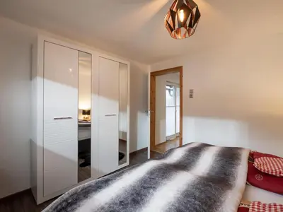 Ein Bett oder Betten in einem Zimmer der Unterkunft Haus Milan