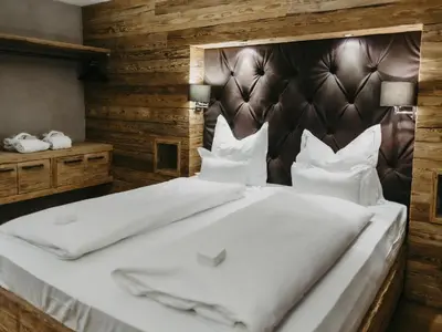Ein Bett oder Betten in einem Zimmer der Unterkunft Chalet-Apartment Lavendel am Lift