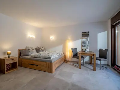 Ein Bett oder Betten in einem Zimmer der Unterkunft Appartement Alpenlöwe