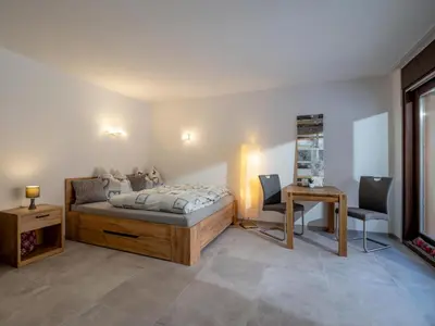 Ein Bett oder Betten in einem Zimmer der Unterkunft Appartement Alpenlöwe