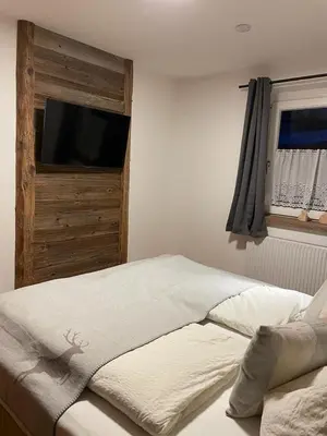 Ein Bett oder Betten in einem Zimmer der Unterkunft Haus Almweg