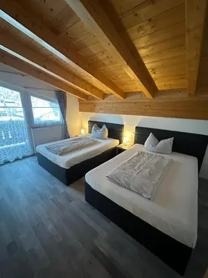 Ein Bett oder Betten in einem Zimmer der Unterkunft LEO Apart 1