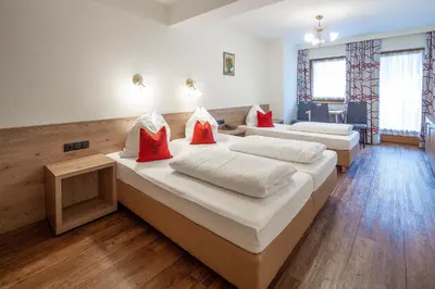 Ein Bett oder Betten in einem Zimmer der Unterkunft Ferienhotel Fuchs