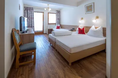 Ein Bett oder Betten in einem Zimmer der Unterkunft Ferienhotel Fuchs