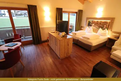 Ein Bett oder Betten in einem Zimmer der Unterkunft Ferienhotel Fuchs