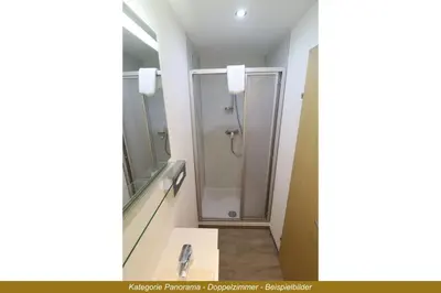 Ein Badezimmer in der Unterkunft Ferienhotel Fuchs