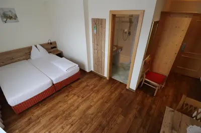 Ein Bett oder Betten in einem Zimmer der Unterkunft Ferienhotel Fuchs
