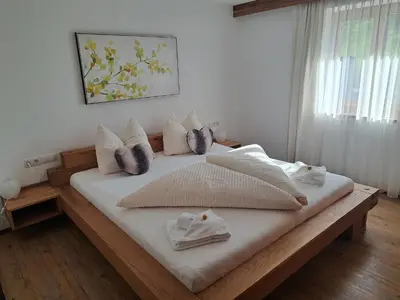 Ein Bett oder Betten in einem Zimmer der Unterkunft Apartment Wasserfall im Zillertal - Oasis of Peace with Panoramic Terrace, near Fügen
