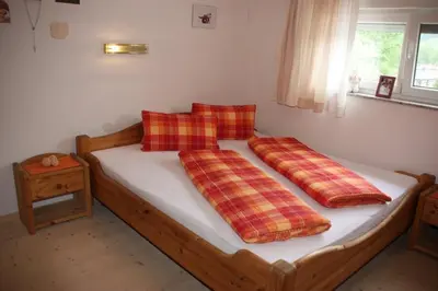 Ein Bett oder Betten in einem Zimmer der Unterkunft Ferienwohnung Zeller