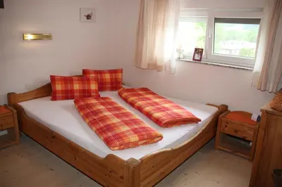 Ein Bett oder Betten in einem Zimmer der Unterkunft Ferienwohnungen Schiestl