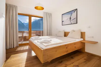 Ein Bett oder Betten in einem Zimmer der Unterkunft Exklusives Chalet-Haus mit Gletscherblick