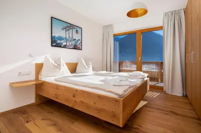 Ein Bett oder Betten in einem Zimmer der Unterkunft Exklusives Chalet-Haus mit Gletscherblick