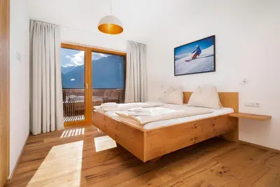 Ein Bett oder Betten in einem Zimmer der Unterkunft Exklusives Chalet-Haus mit Gletscherblick