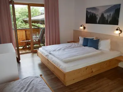 Ein Bett oder Betten in einem Zimmer der Unterkunft Haus Thussn, Ferienwohnung für Familien und Paare