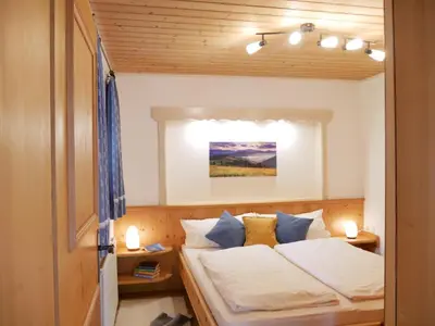 Ein Bett oder Betten in einem Zimmer der Unterkunft Haus Thussn, Ferienwohnung für Familien und Paare