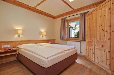 Ein Bett oder Betten in einem Zimmer der Unterkunft Das Hopfgarten Aparthotel