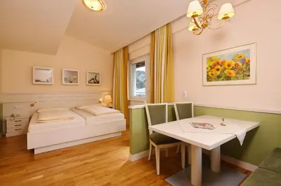 Ein Bett oder Betten in einem Zimmer der Unterkunft Das Hopfgarten Aparthotel