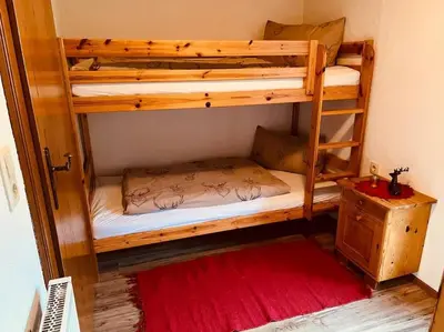 Ein Bett oder Betten in einem Zimmer der Unterkunft Ferienwohnung Gamsbock Panorama View Balkon, Gartensauna, Garten, Grillplatz