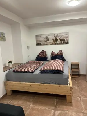 Ein Bett oder Betten in einem Zimmer der Unterkunft Kössen Dorf 41 TOP4