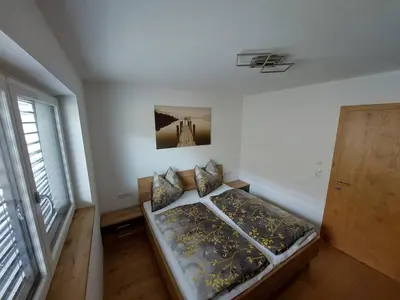 Ein Bett oder Betten in einem Zimmer der Unterkunft Apart Haselbach