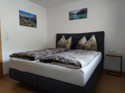 Ein Bett oder Betten in einem Zimmer der Unterkunft Apart Haselbach