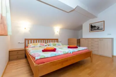 Ein Bett oder Betten in einem Zimmer der Unterkunft Ferienwohnungen Lahner