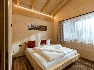 Ein Bett oder Betten in einem Zimmer der Unterkunft Alpenchalets Oberlaiming