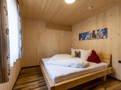 Ein Bett oder Betten in einem Zimmer der Unterkunft Alpenchalets Oberlaiming