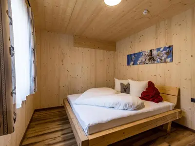 Ein Bett oder Betten in einem Zimmer der Unterkunft Alpenchalets Oberlaiming