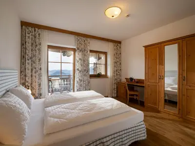 Ein Bett oder Betten in einem Zimmer der Unterkunft jezz AlmResort Ellmau