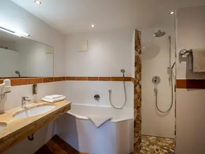 Ein Badezimmer in der Unterkunft jezz AlmResort Ellmau