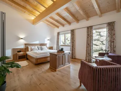 Ein Bett oder Betten in einem Zimmer der Unterkunft jezz AlmResort Ellmau