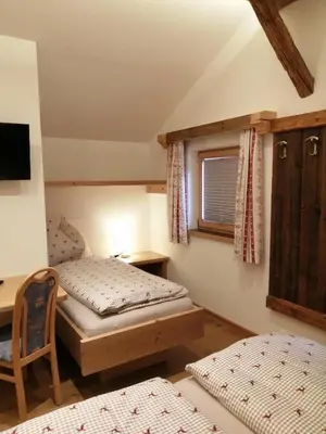 Ein Bett oder Betten in einem Zimmer der Unterkunft Hintergugg