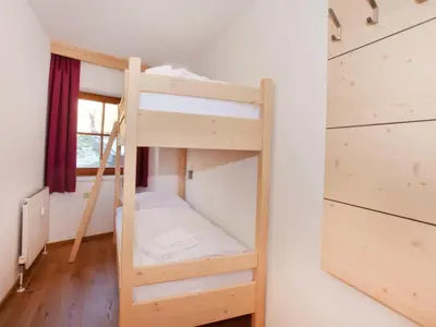 Ein Bett oder Betten in einem Zimmer der Unterkunft Apartment Wald im Pinzgau near Ski Lift