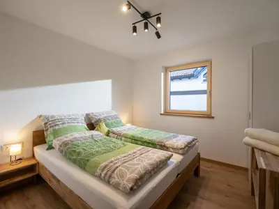 Ein Bett oder Betten in einem Zimmer der Unterkunft Berg Apartment Barbara