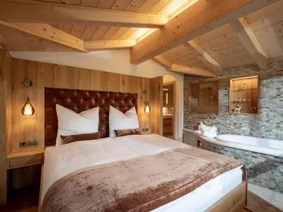 Ein Bett oder Betten in einem Zimmer der Unterkunft Luxusappartement Alpenliebe