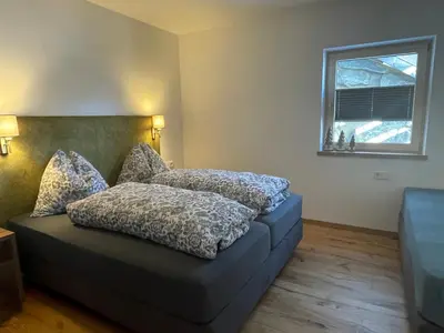 Ein Bett oder Betten in einem Zimmer der Unterkunft Ferienwohnung Traumblick -Familie Seber